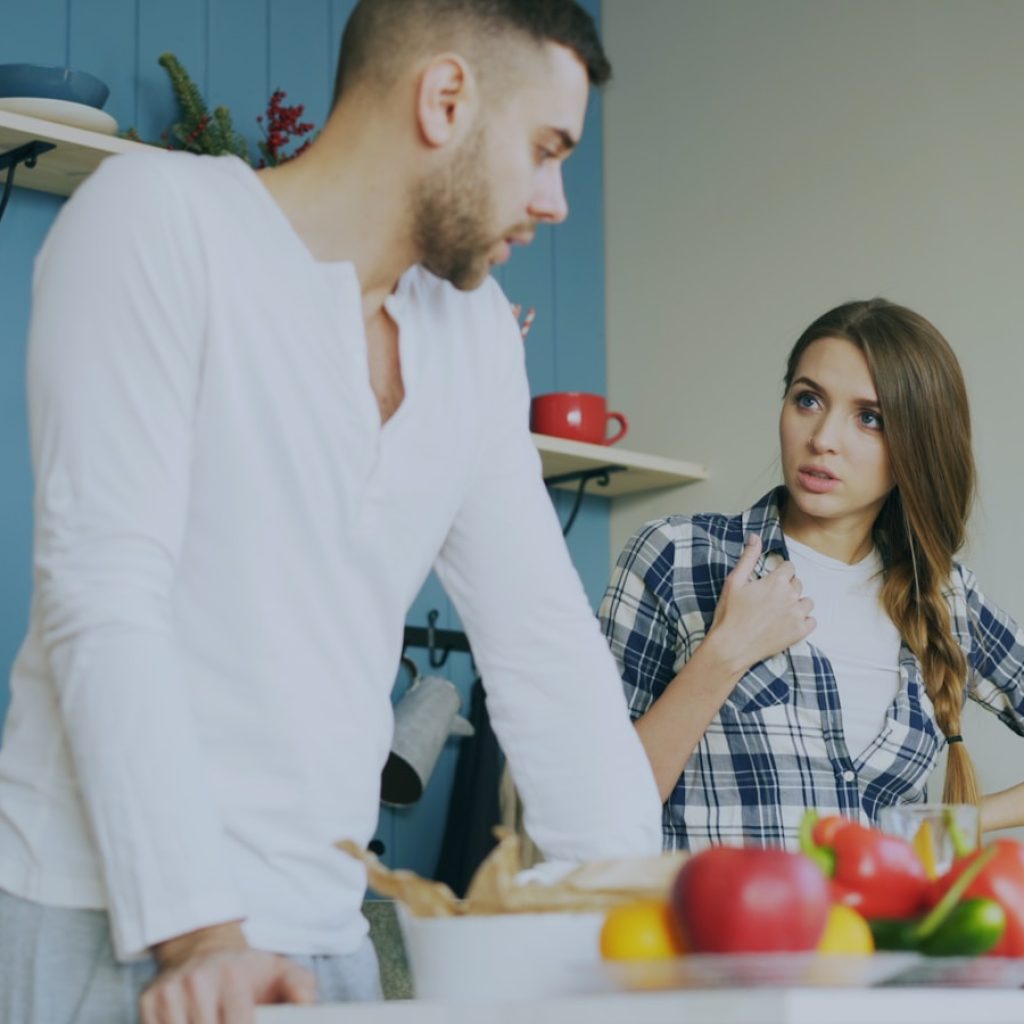 Couple arguing in a kitchen