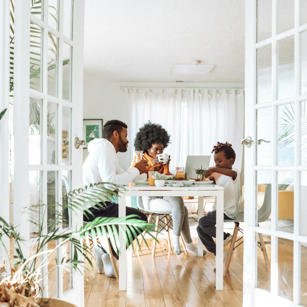 people sitting on chairs in front of table