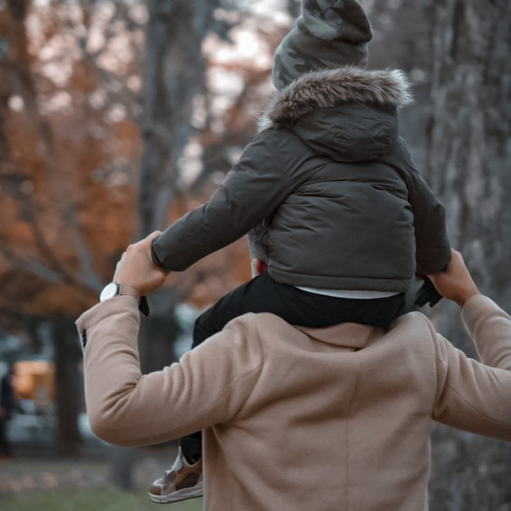 a woman holding a child in her arms