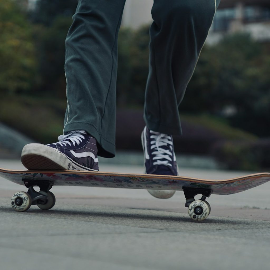 man skateboarding on gray ground