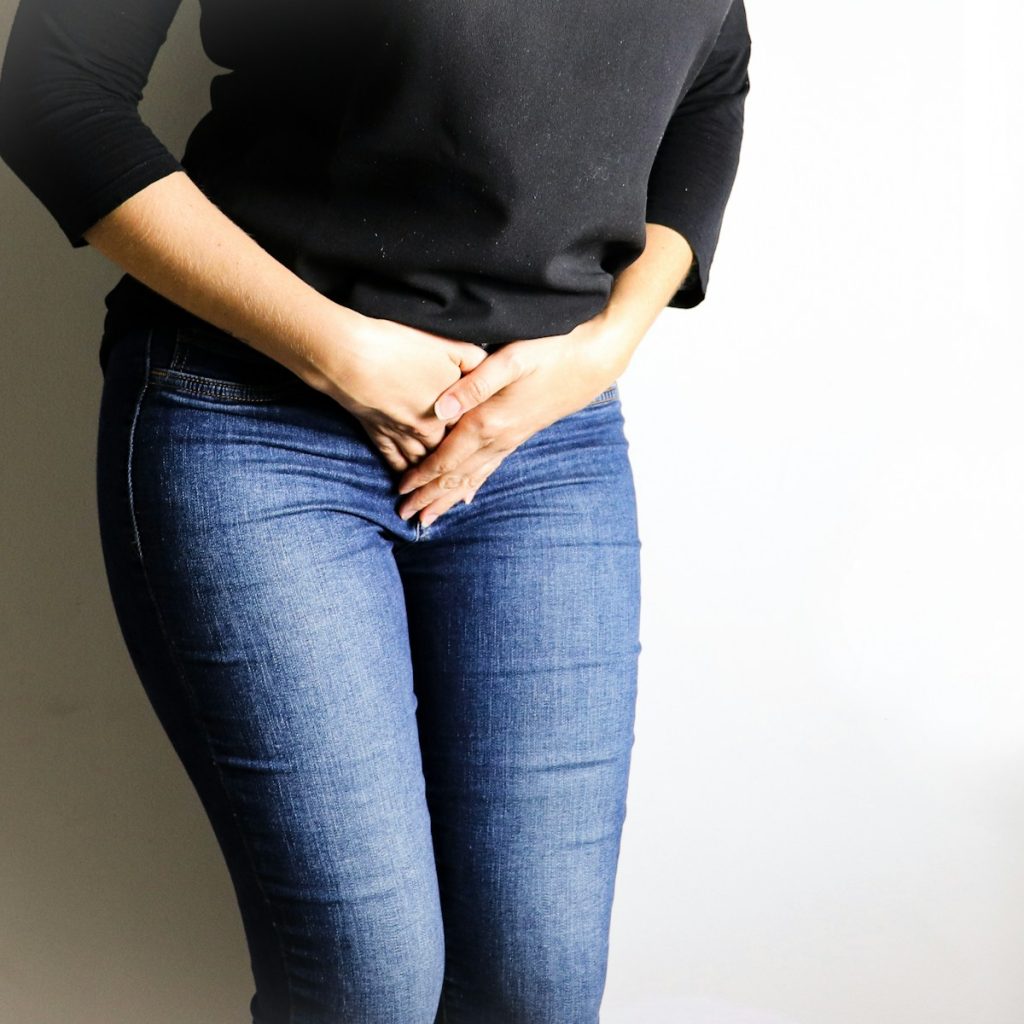 woman in black long sleeve shirt and blue denim jeans