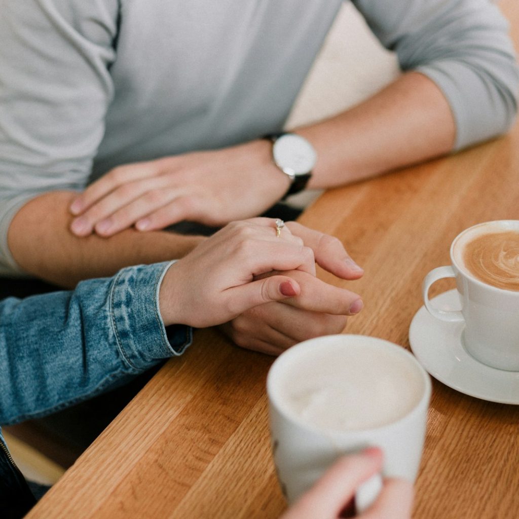 man and woman holding hands